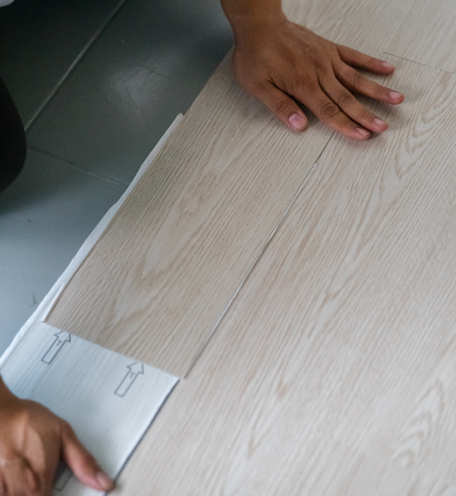 Light Oak laminate flooring, professionally installed with expert care by UK Carpets and Curtains.